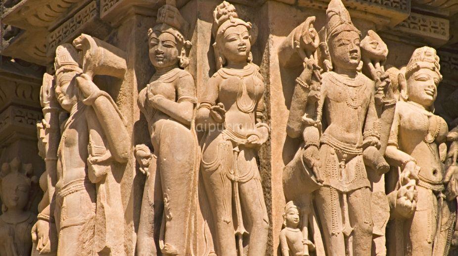 Khajuraho India: Erotic Temple Statues in red sandstoneMany similar Khajuraho images are in my lightbox at http://www.istockphoto.com/my_lightbox_contents.phplightboxID=970537